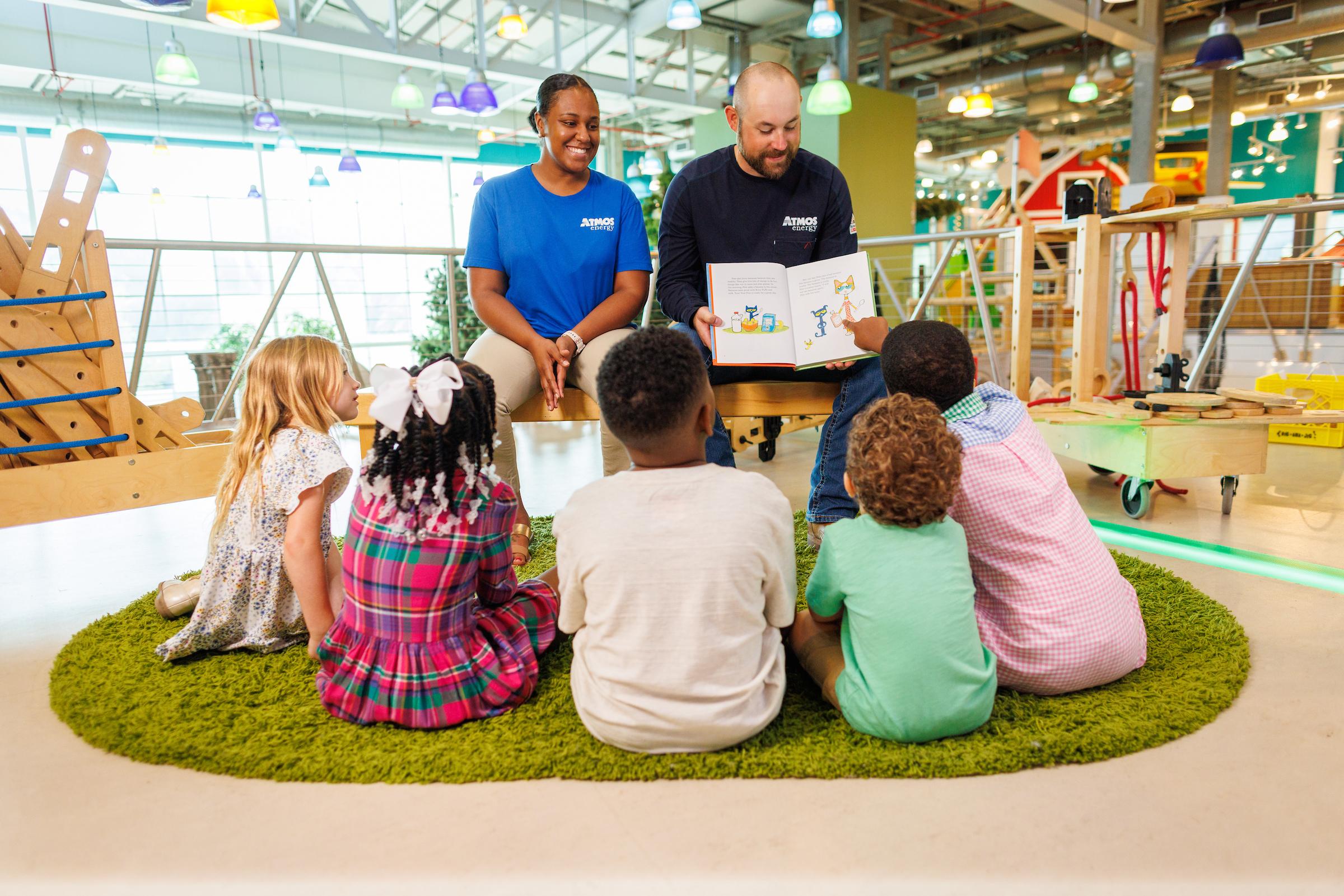 Atmos Energy employees reading to school children Atmos Energy employees reading to school children