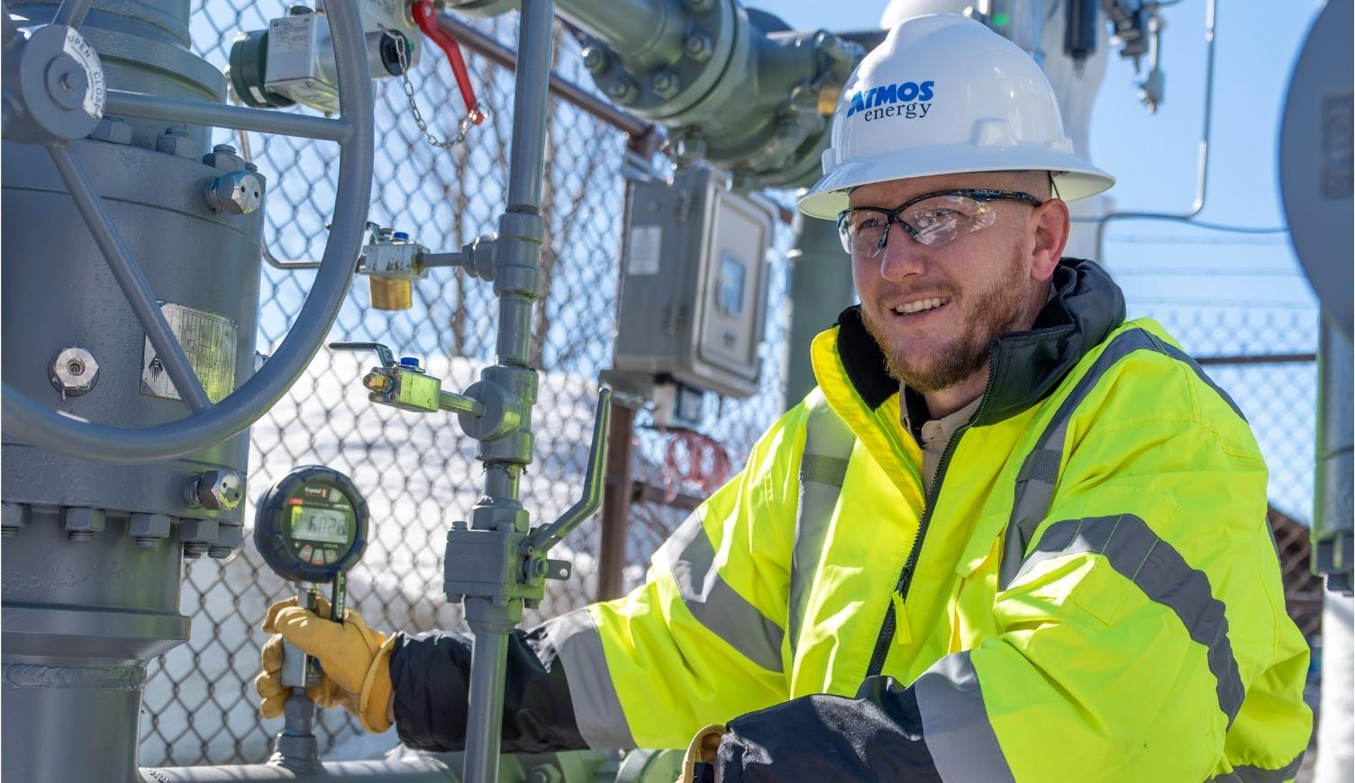 Atmos Energy technician wearing a hard hat for winter maintenance