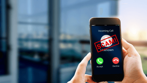 Black cell phone displaying scammer calling